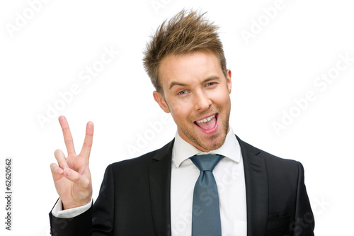 Portrait of victory gesturing businessman, isolated 