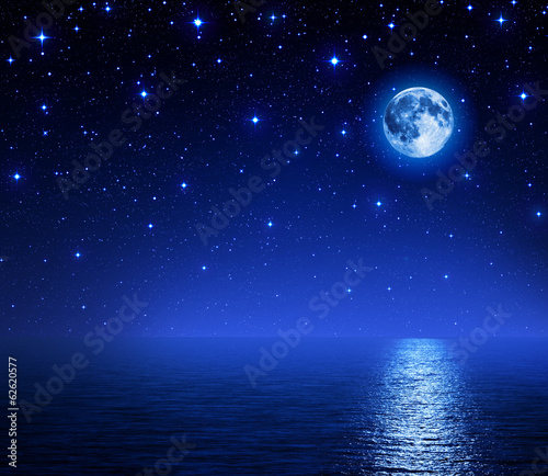 super moon in starry sky on sea