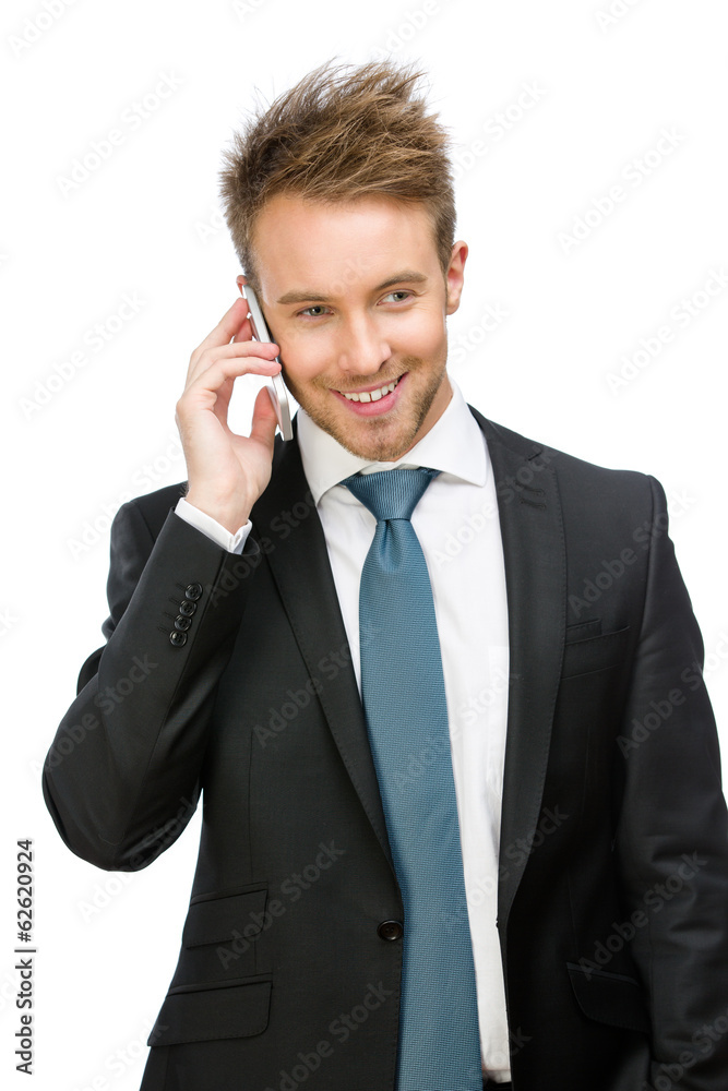 Half-length portrait of businessman speaking on cell phone Half-length portrait of businessman speaking on cell phone