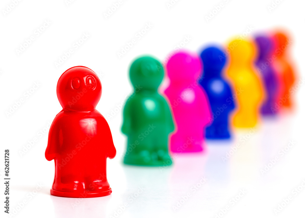 Colorful toy people group in queue on white background Colorful toy people group in queue on white background