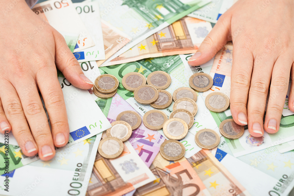 Businessperson With Banknotes And Coins Businessperson With Banknotes And Coins