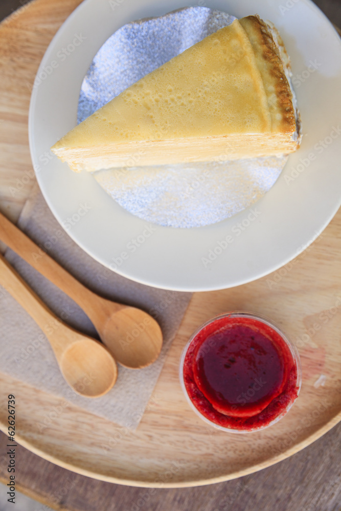 Crepe cake with strawberry sauce