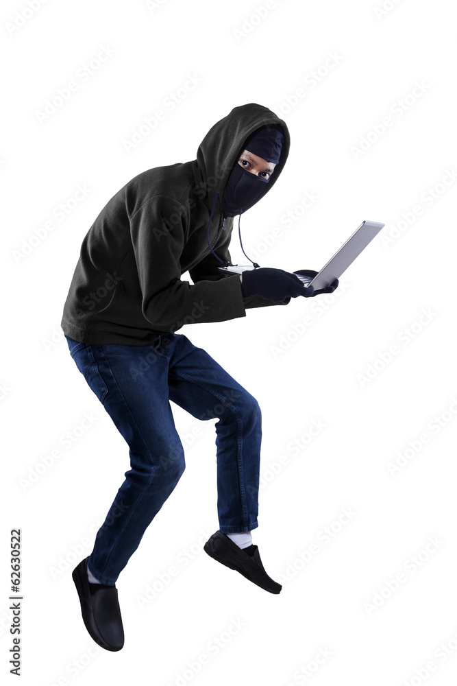 A thief is stealing a laptop computer A thief is stealing a laptop computer