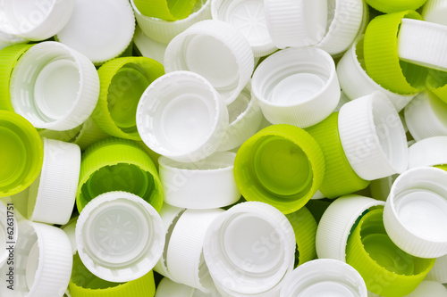 White & green plastic bottole caps photo