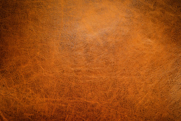 Brown leather textured background with side light.
