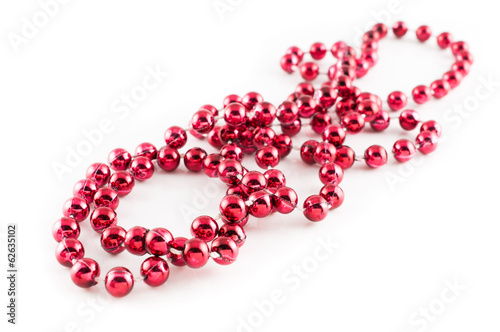 Mardi Gras party red beads placed in white background