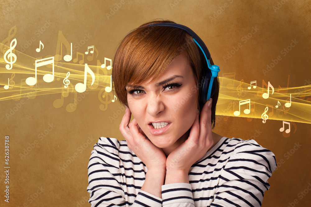 Fototapeta premium Young woman with headphones listening to music