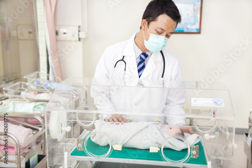 doctor examine a fake infant body situation