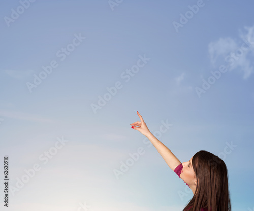 Girl looking at the blue sky copyspace