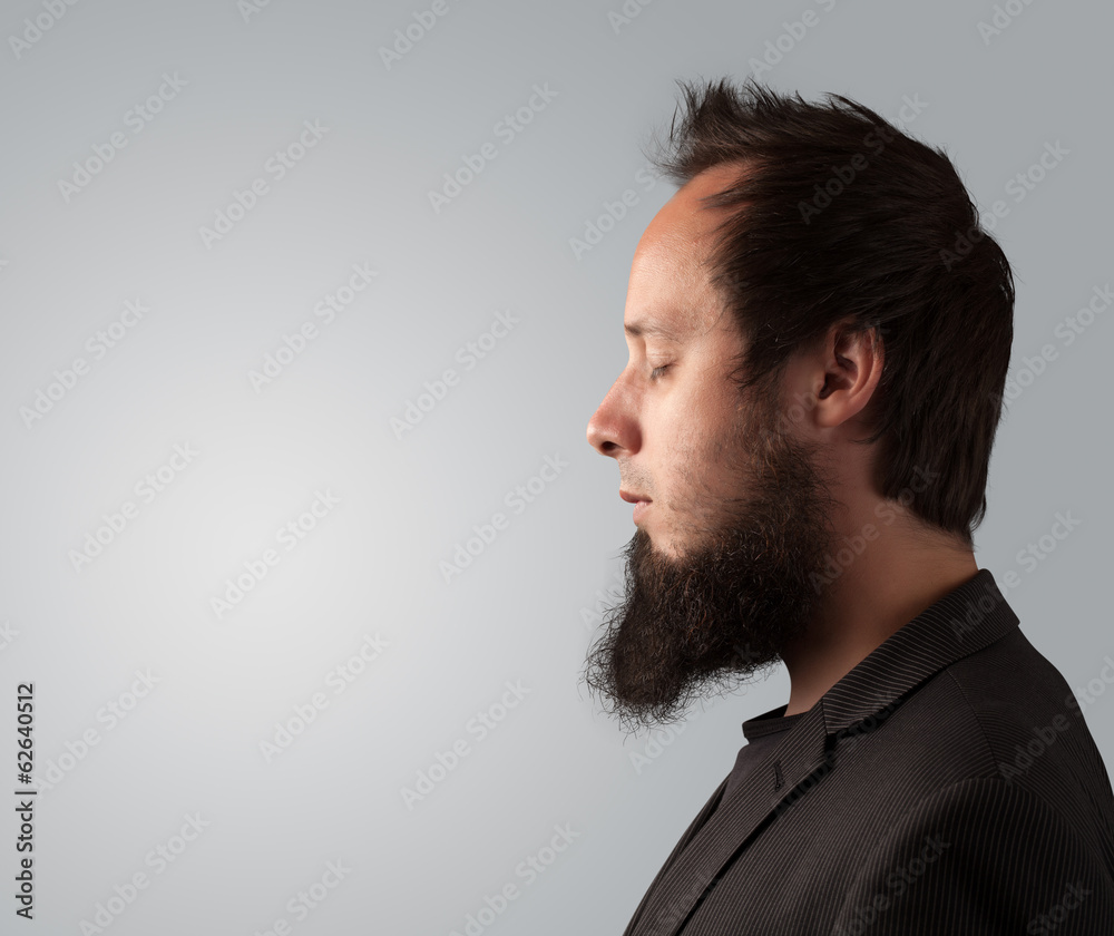 Obraz premium Young businessman thinking with copyspace