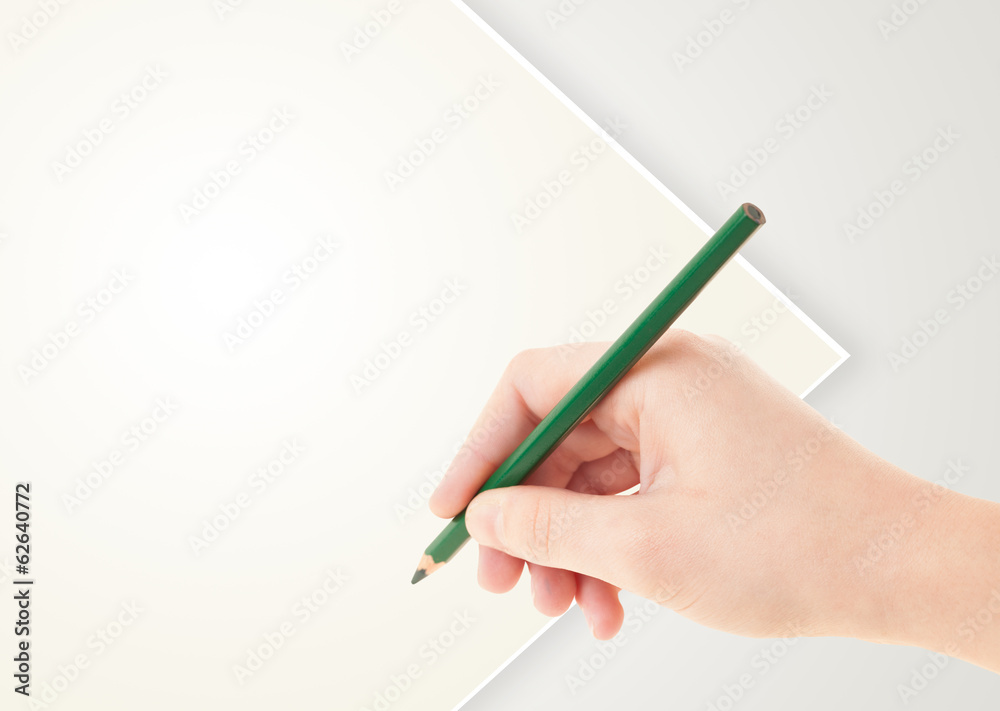 Human hand drawing with pencil on empty paper template Human hand drawing with pencil on empty paper template