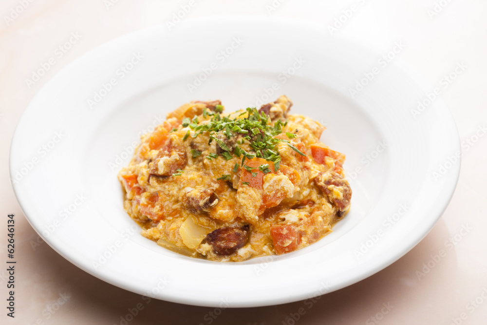 meal called leco (mixture of vegetables and eggs with sausage) meal called leco (mixture of vegetables and eggs with sausage)