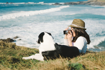 Funky woman taking photo to her dog