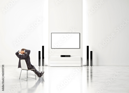 businessman watching home cinema