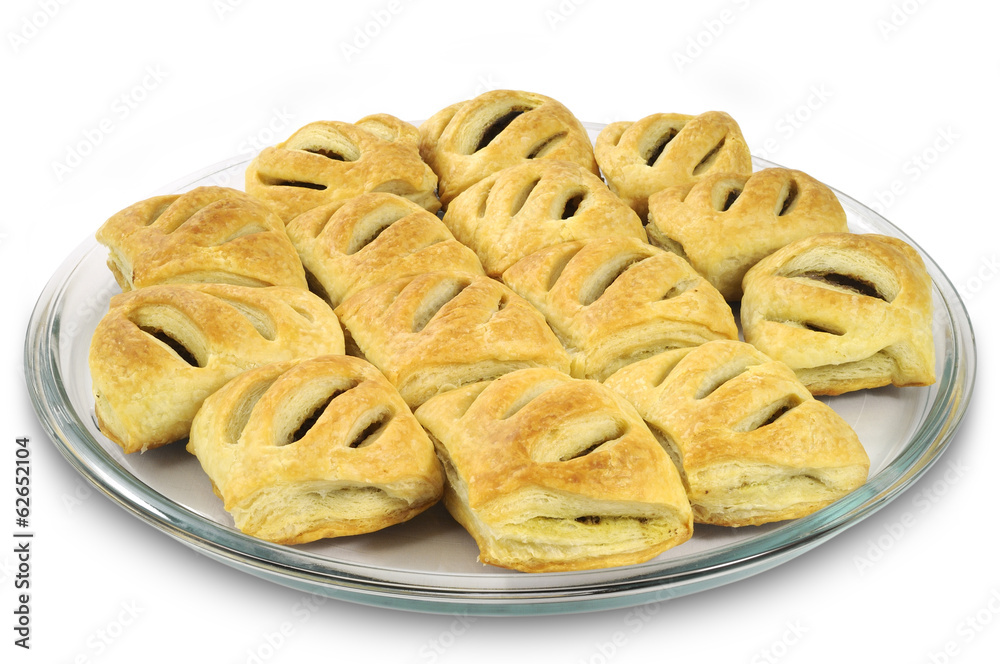 Homemade pasties with meat on glass plate