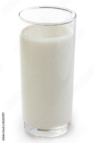 Tall glass of milk over a white bachground