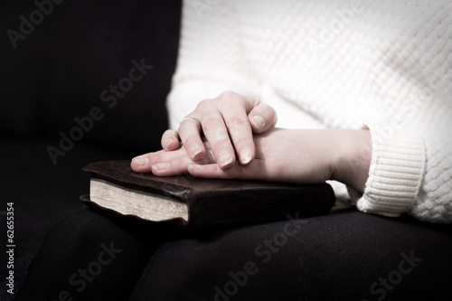 Praying woman with her bible