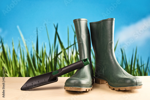 Green rubber boots for garden work photo