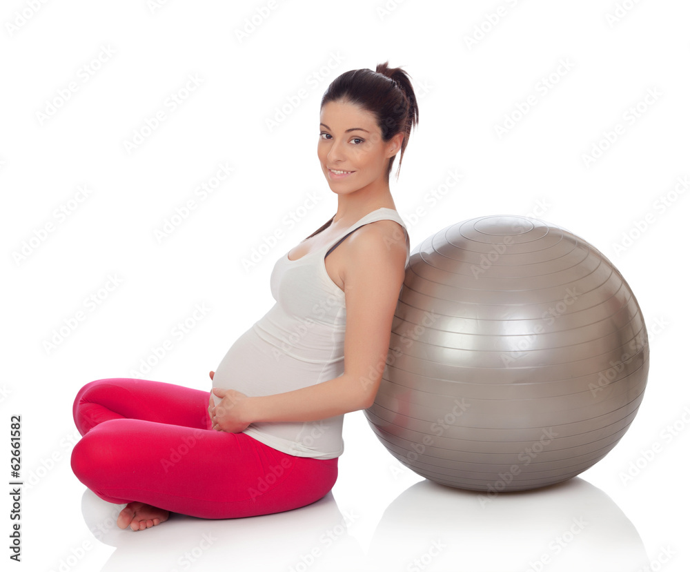 Beautiful pregnant woman doing pilates Beautiful pregnant woman doing pilates