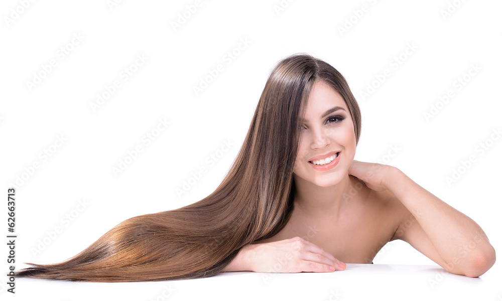 Obraz premium Beautiful young woman with long hair isolated on white