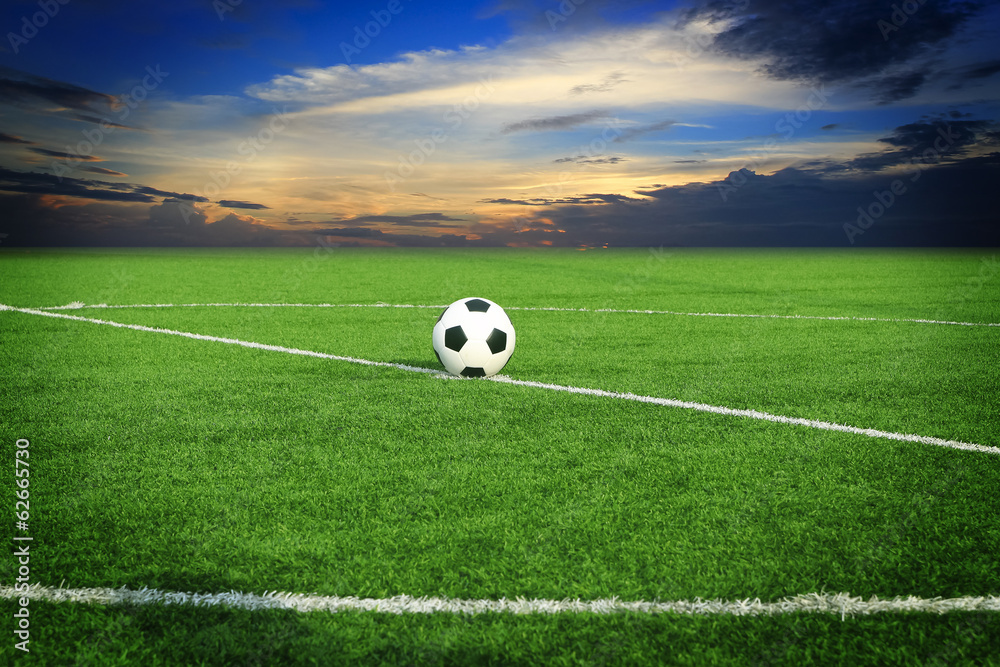 soccer ball on soccer field with sun set soccer ball on soccer field with sun set