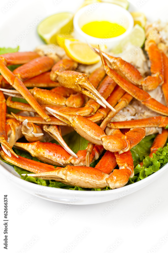 Crab legs with fresh lemon and butter sauce. Selective focus Crab legs with fresh lemon and butter sauce. Selective focus