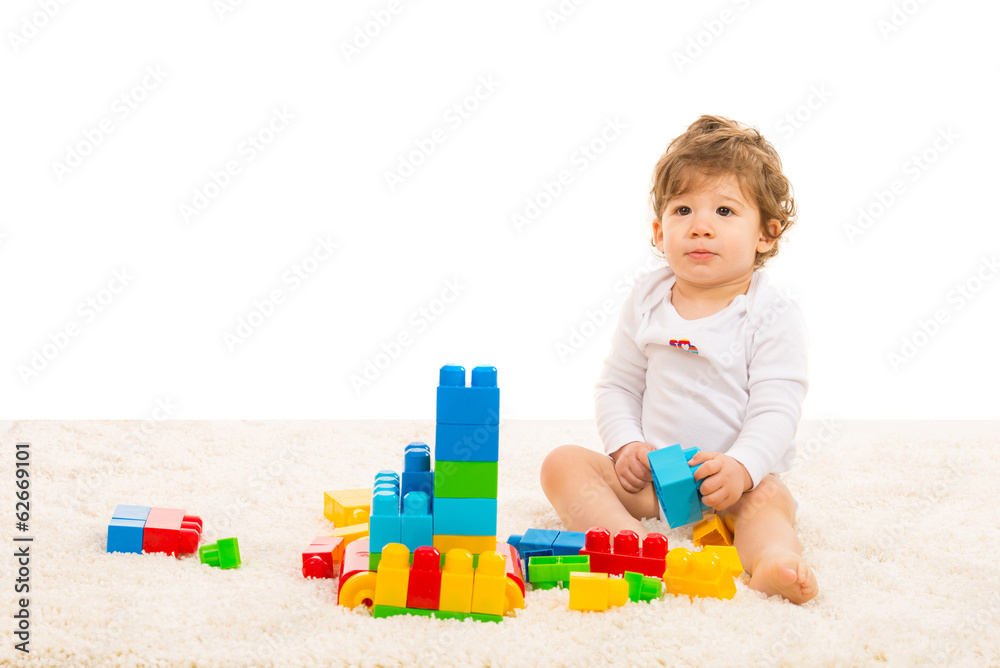 Toddler boy playing with building blocks Toddler boy playing with building blocks