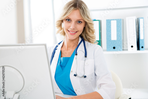 Female doctor with computer
