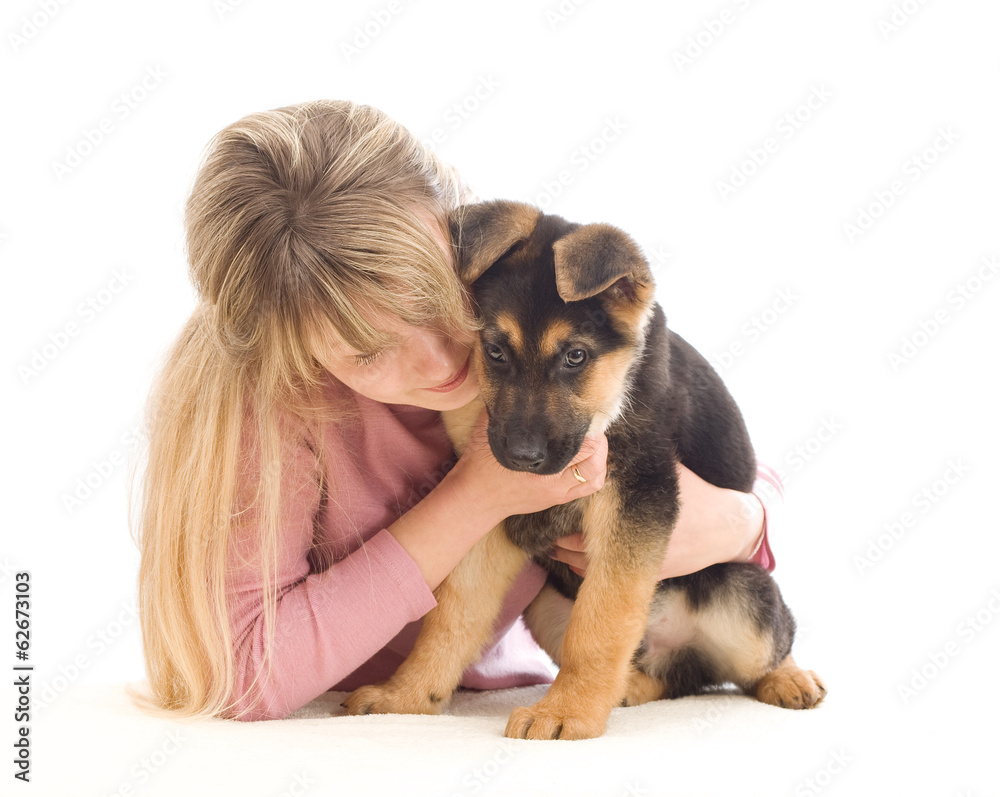 young woman affectionately hugging a puppy young woman affectionately hugging a puppy