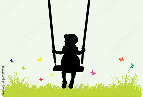 Little girl on a swing .