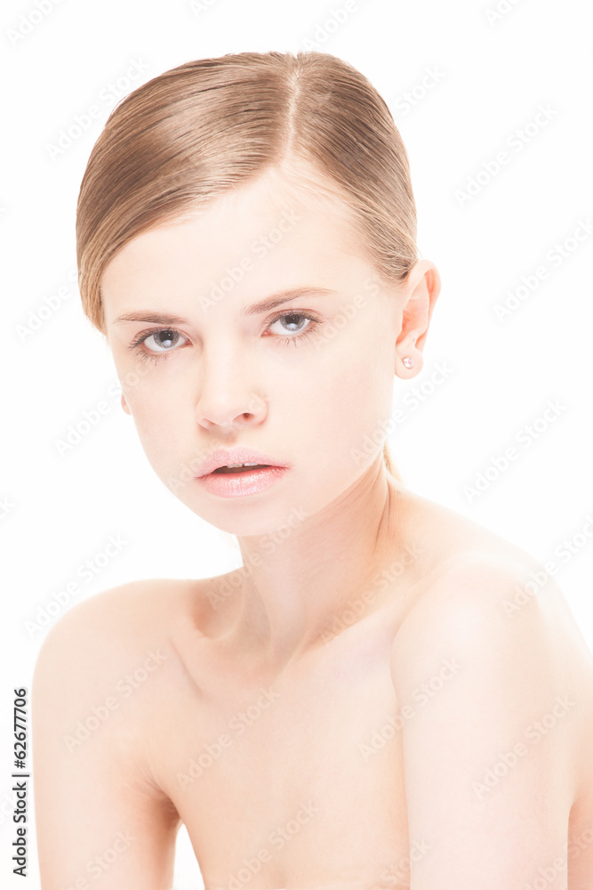 Portrait of beautiful young woman with clean face. High key shot Portrait of beautiful young woman with clean face. High key shot