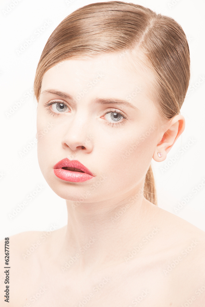 Portrait of beautiful young woman with clean face. High key shot Portrait of beautiful young woman with clean face. High key shot