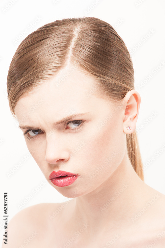 Portrait of beautiful young woman with clean face. High key shot