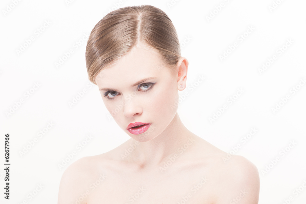 Portrait of beautiful young woman with clean face. High key shot Portrait of beautiful young woman with clean face. High key shot