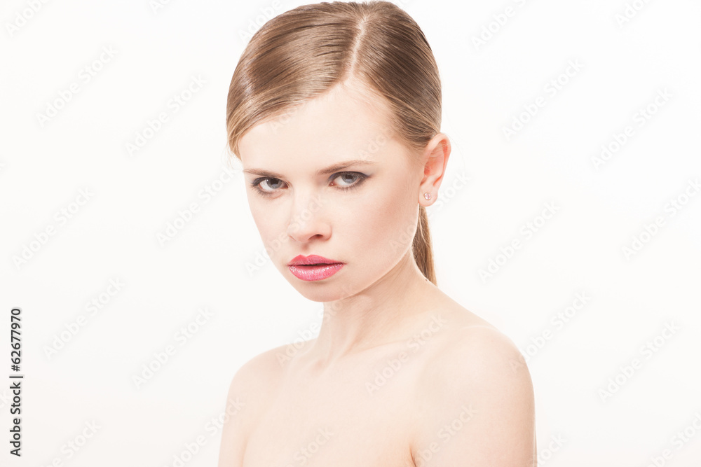 Portrait of beautiful young woman with clean face. High key shot Portrait of beautiful young woman with clean face. High key shot