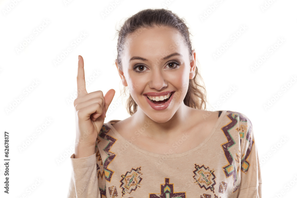 smiling girl shows finger up smiling girl shows finger up