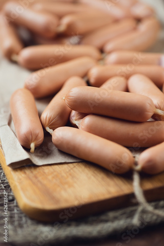Close-up of raw sausages, vertical shot, shallow depth of field