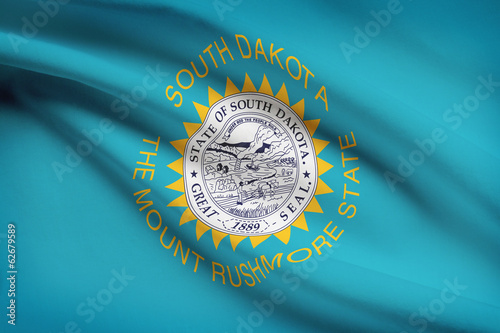 Series of ruffled flags of US states. State of South Dakota. photo