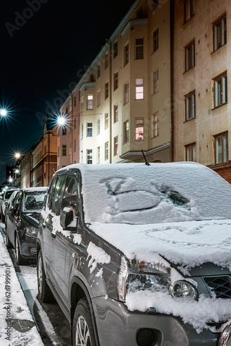 Obraz na płótnie Car covered with snow on winter night w salonie