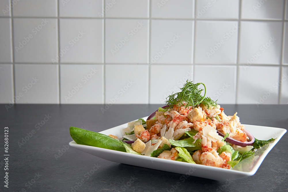 Delicious shrimp ceasar salad on a plate