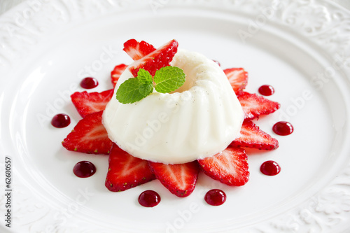 Strawberry blancmange garnished with fresh strawbe