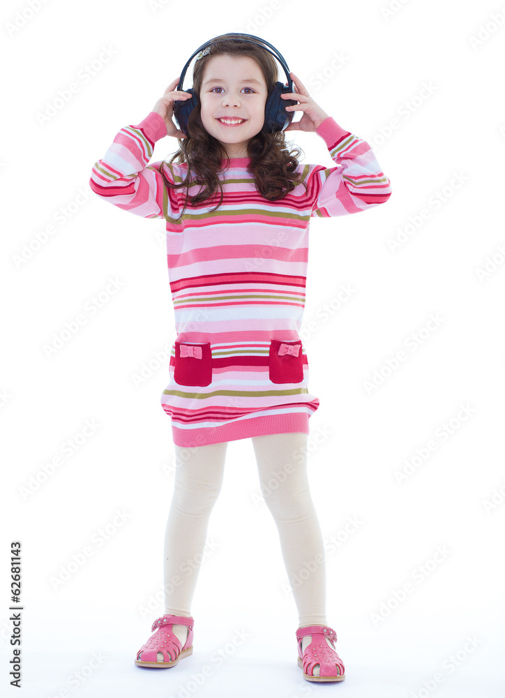 Beautiful cute happy little girl with headphones. Beautiful cute happy little girl with headphones.