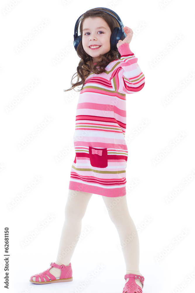 Beautiful cute happy little girl with headphones. Beautiful cute happy little girl with headphones.