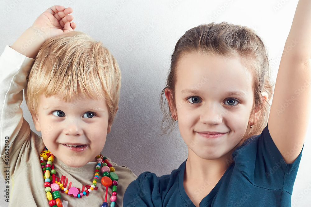 Small blond boy and girl pull hands up Small blond boy and girl pull hands up