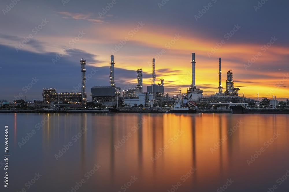 Oil refinery with sunrise background