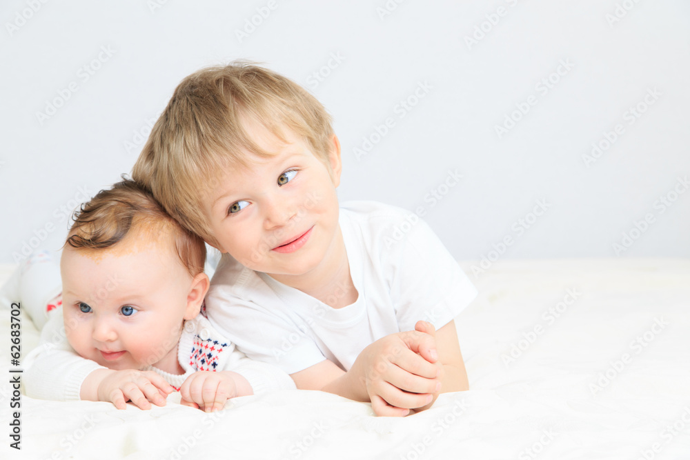 portrait of little boy with newborn sister portrait of little boy with newborn sister