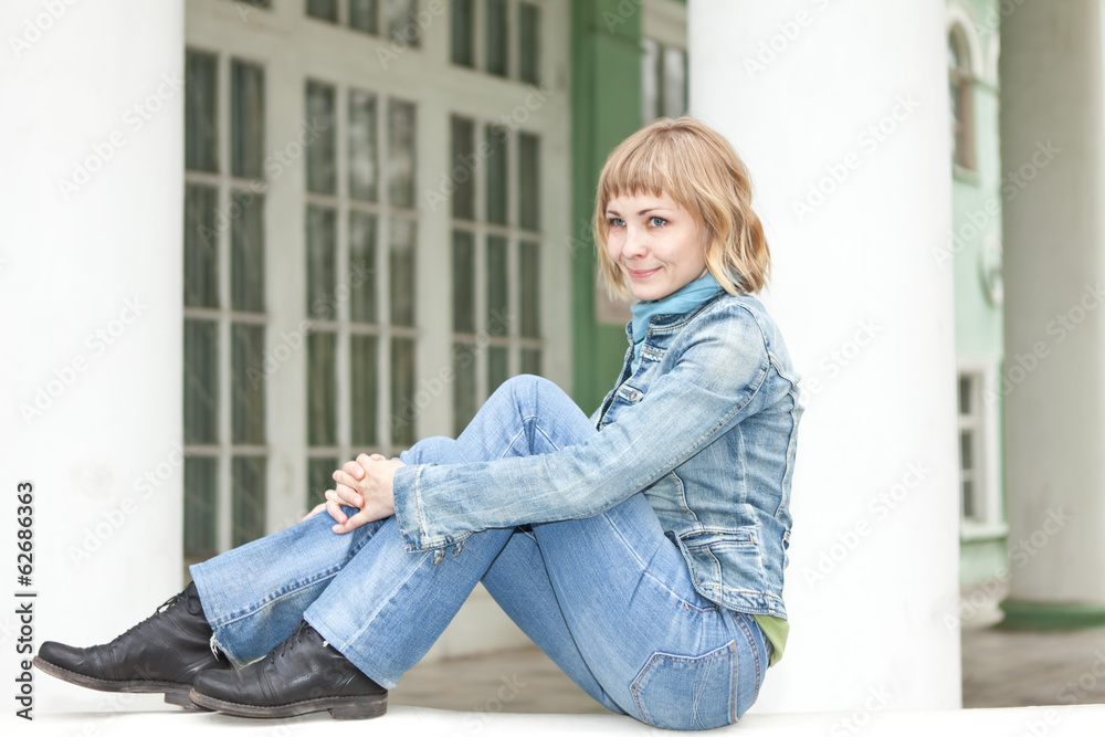 girl in an urban denim clothes posing in a park girl in an urban denim clothes posing in a park