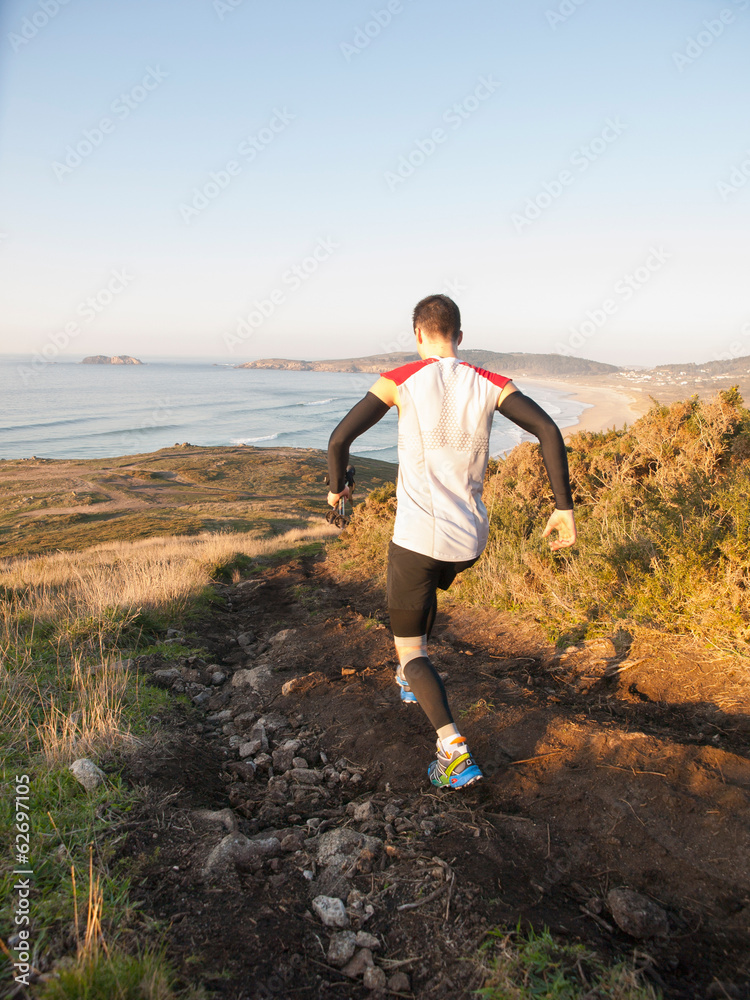Man practicing trail running in nature