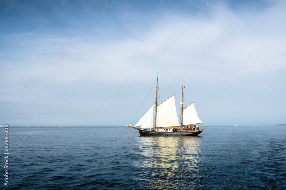 Tall ship on blue water horizontal