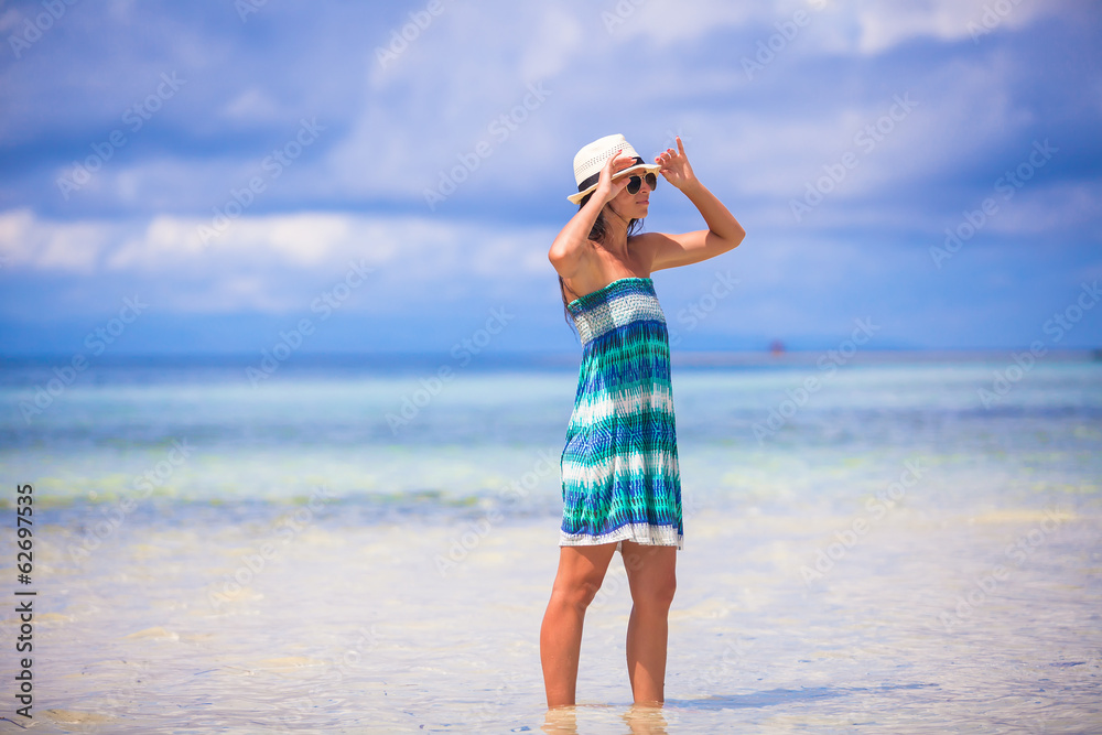 Young beautiful woman enjoying holiday on the beach Young beautiful woman enjoying holiday on the beach